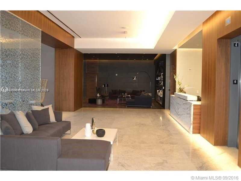 68 Southeast 6th Street, Unit 3510 Miami, FL 33131 - Photo 14 of 20 a living room with furniture and a bathroom