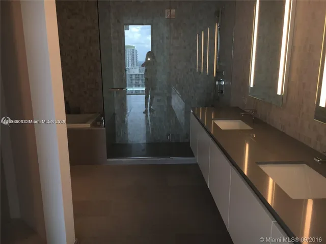a bathroom with a sink and mirror
