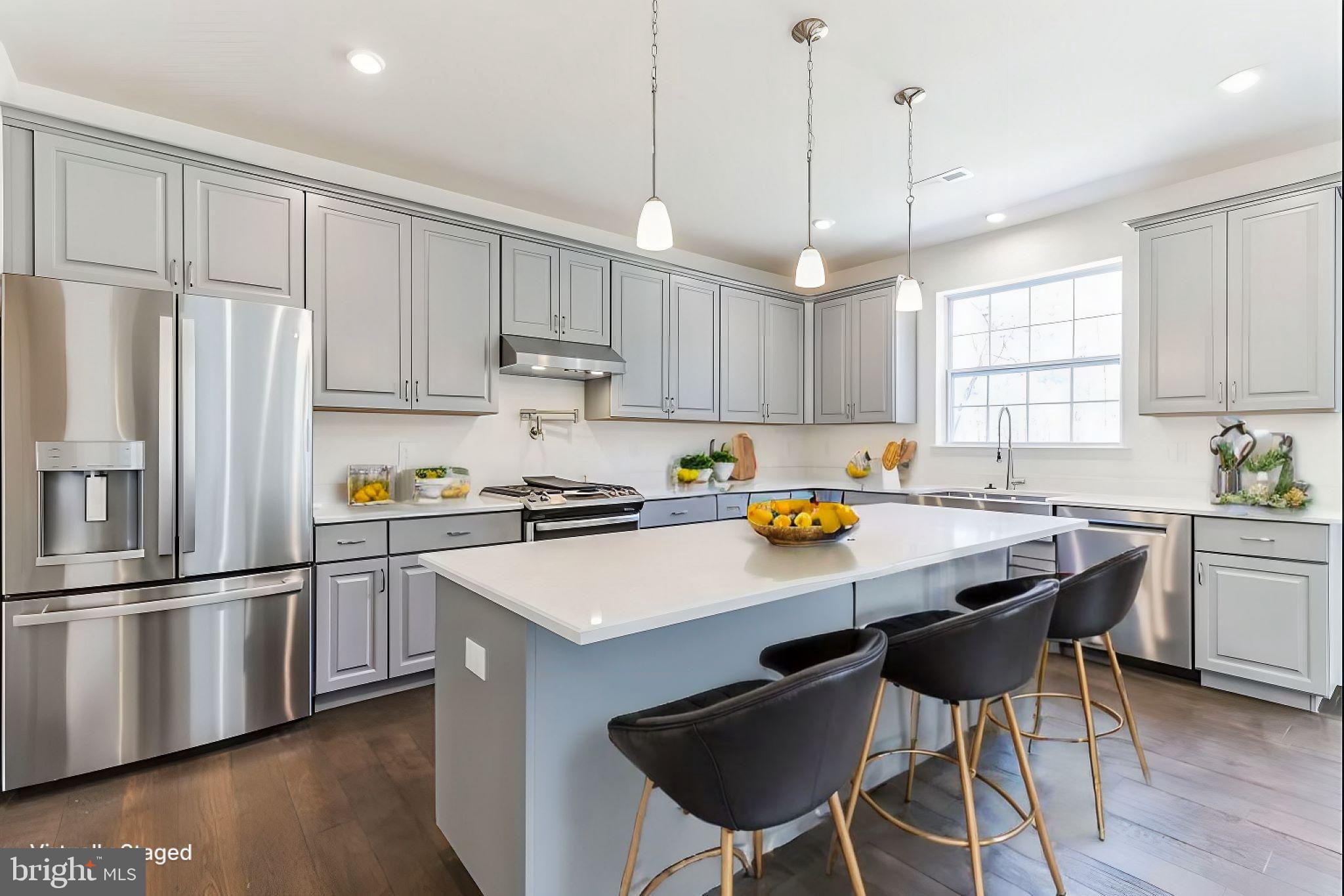 51 Edison Road Cherry Hill, NJ 08034 - Photo 7 of 22 a kitchen with stainless steel appliances granite countertop a sink a stove a refrigerator and island with wooden floor