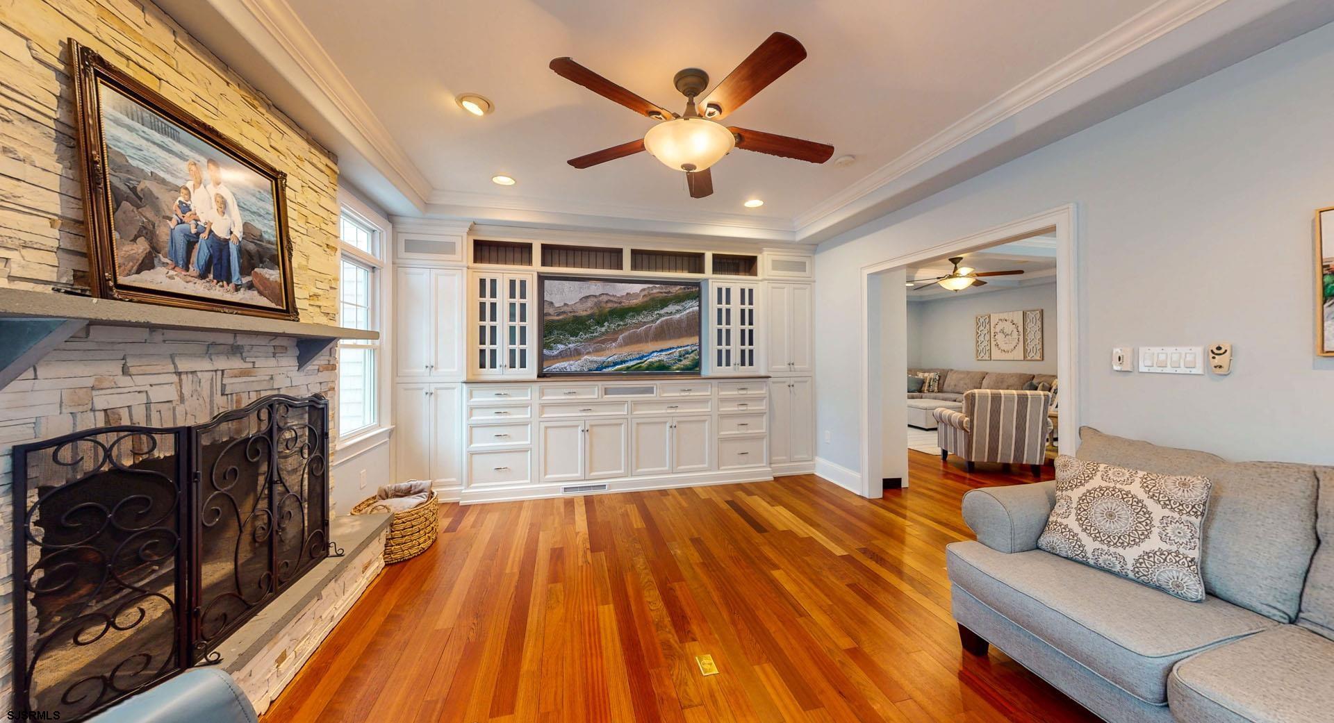 53 Bay Road Ocean City, NJ 08226 - Photo 12 of 68 a living room with furniture and a fireplace