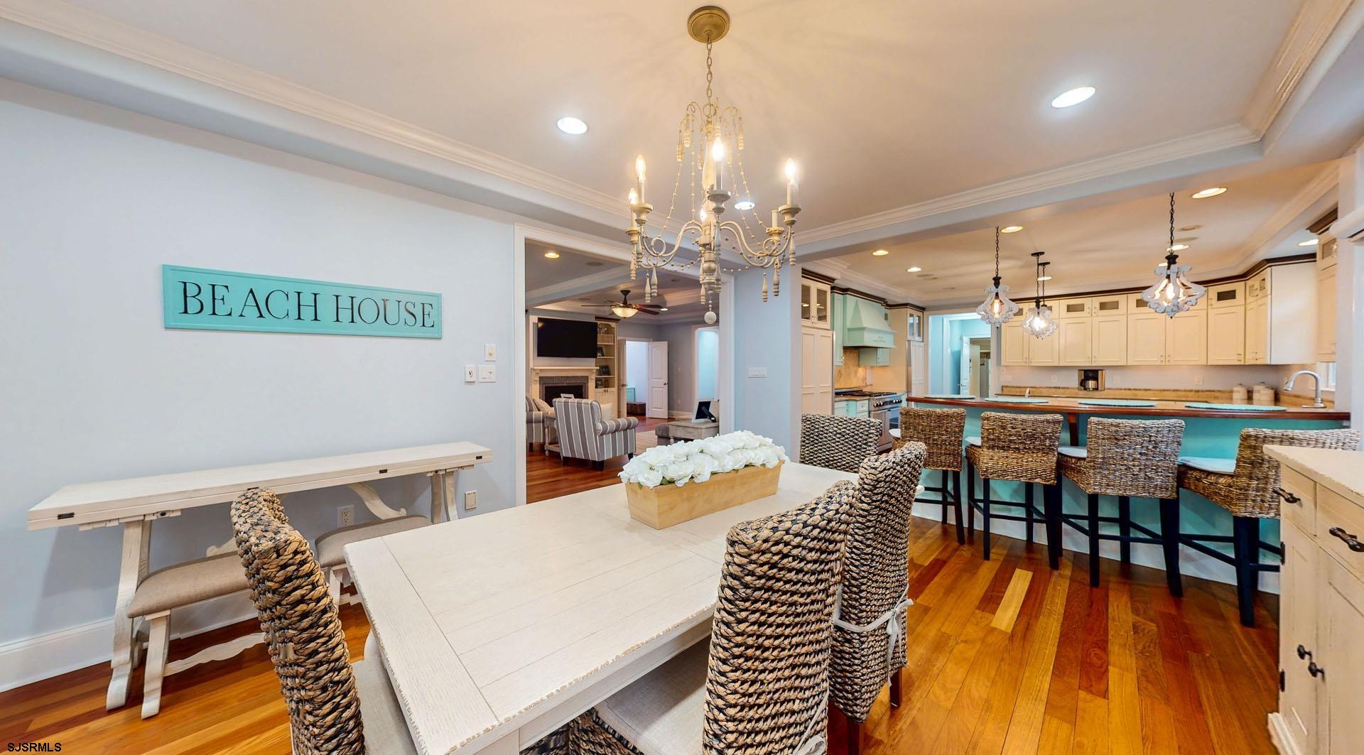 53 Bay Road Ocean City, NJ 08226 - Photo 15 of 68 a view of a dining room with furniture window and wooden floor