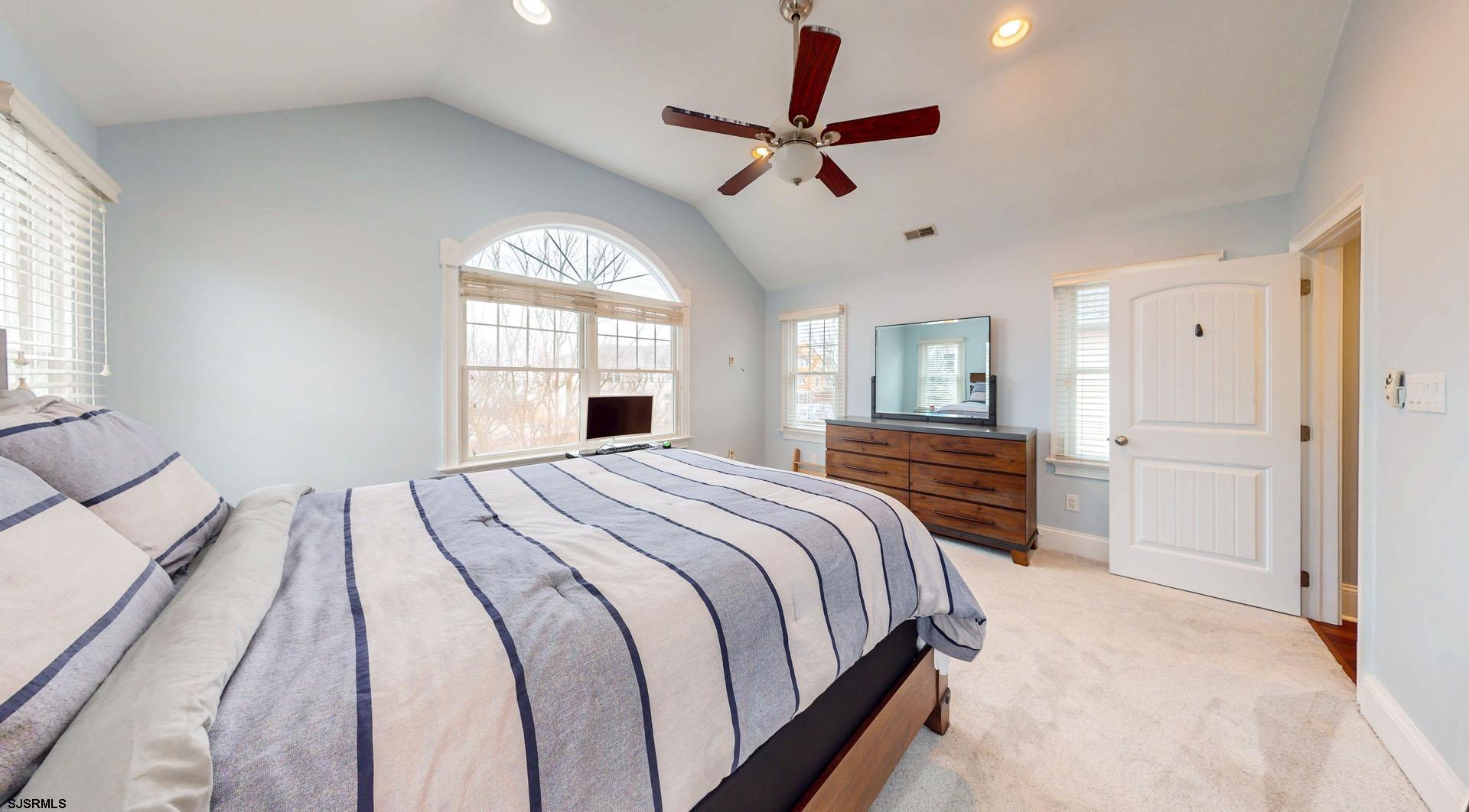53 Bay Road Ocean City, NJ 08226 - Photo 25 of 68 a bedroom with a large bed and a window