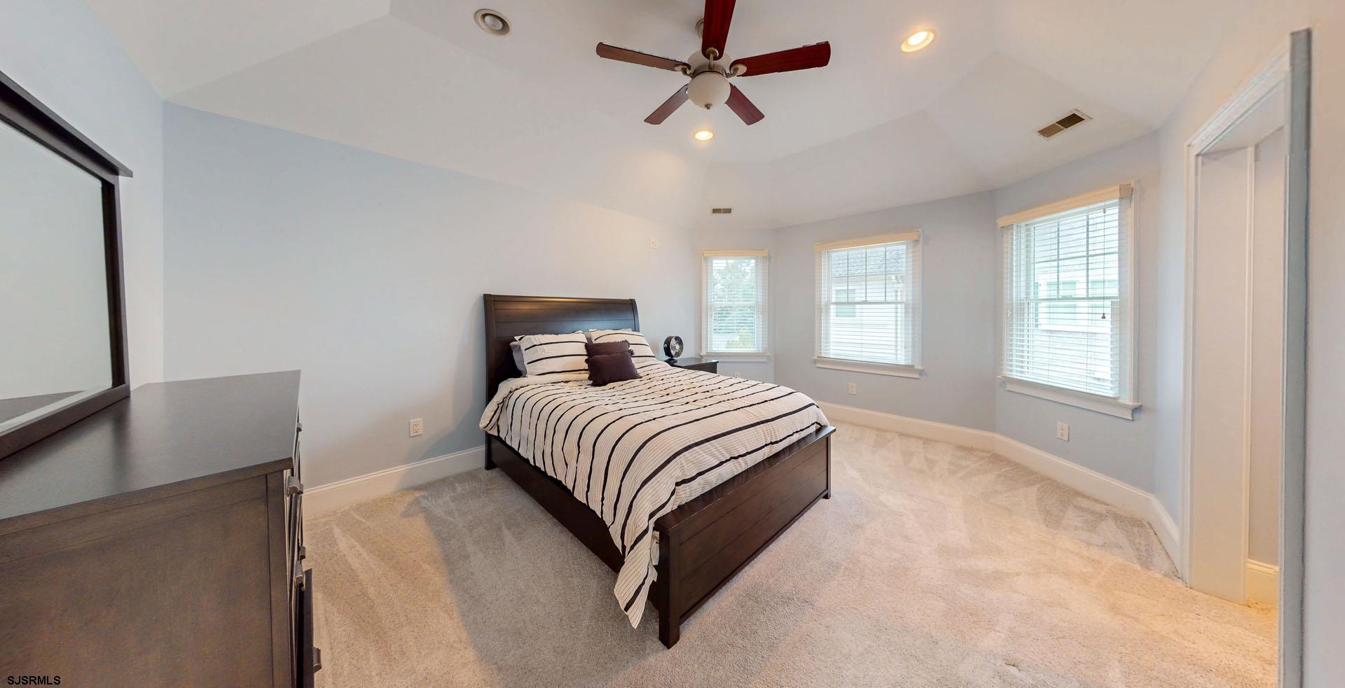 53 Bay Road Ocean City, NJ 08226 - Photo 27 of 68 a bedroom with a large bed and a window