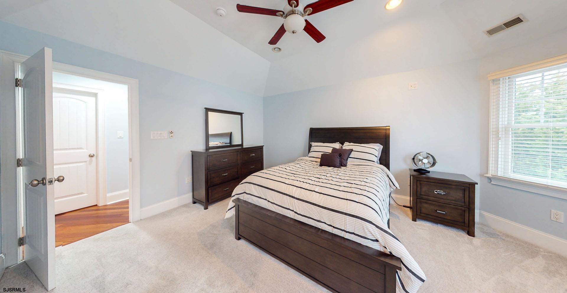 53 Bay Road Ocean City, NJ 08226 - Photo 29 of 68 a bedroom with a bed and window