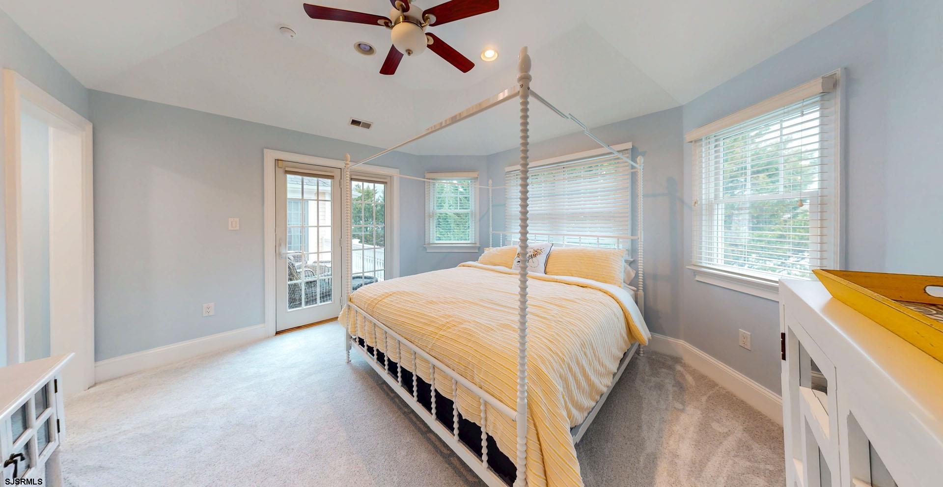 53 Bay Road Ocean City, NJ 08226 - Photo 33 of 68 a bed sitting in a spacious bedroom next to a window