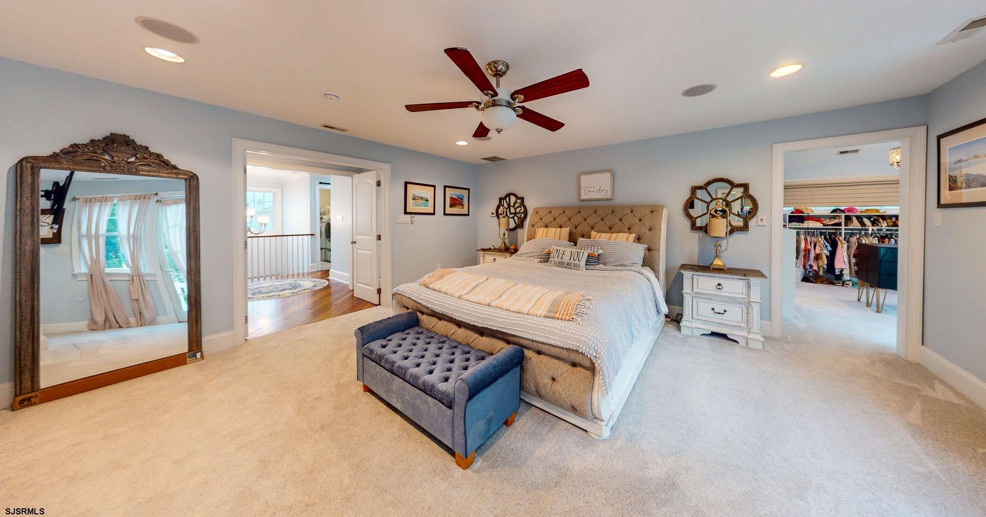53 Bay Road Ocean City, NJ 08226 - Photo 37 of 68 a living room with furniture a ceiling fan and a rug