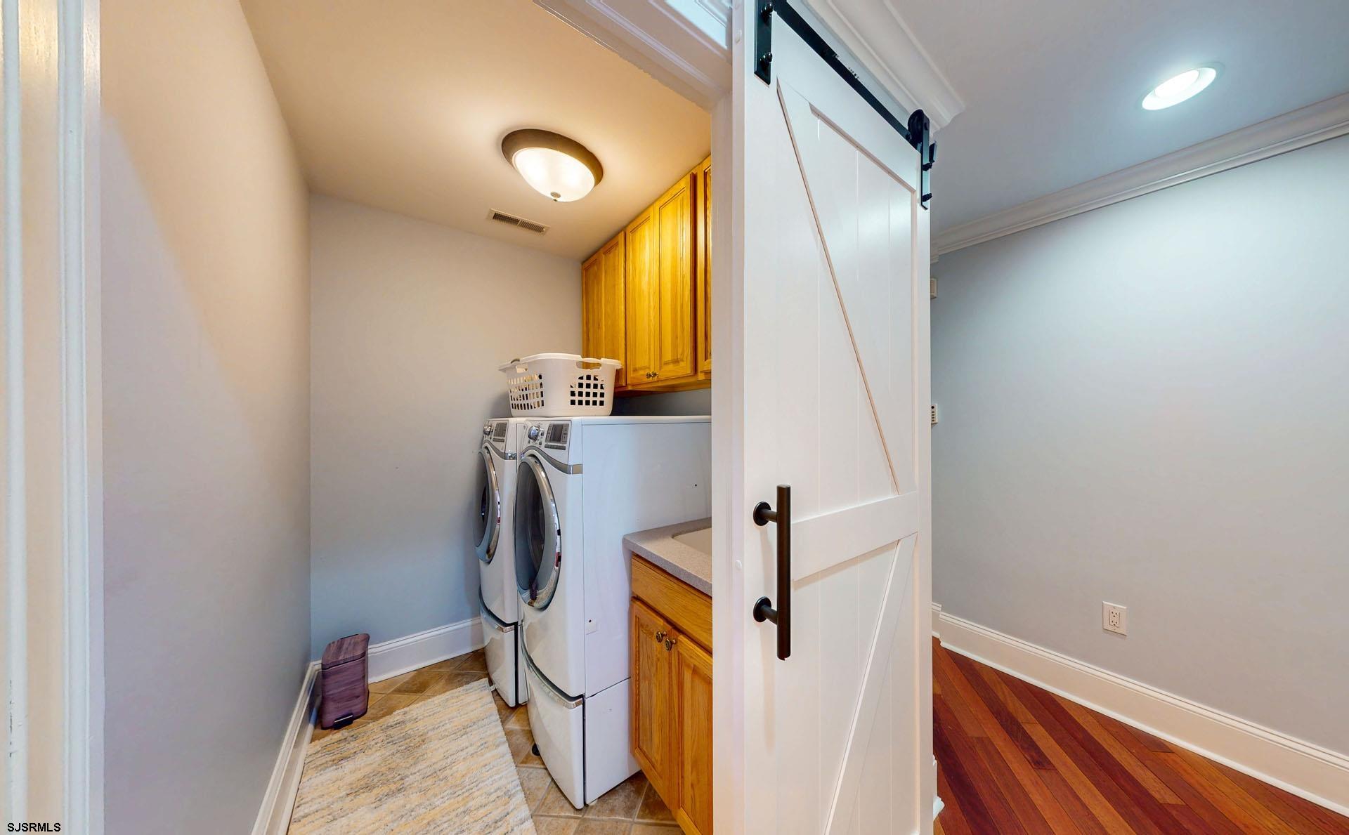 53 Bay Road Ocean City, NJ 08226 - Photo 45 of 68 a view of a storage & utility room with washer and dryer