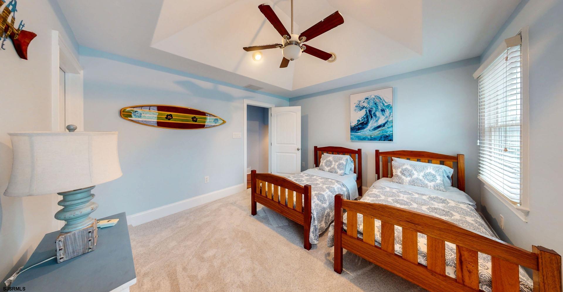 53 Bay Road Ocean City, NJ 08226 - Photo 47 of 68 a bedroom with furniture and a window