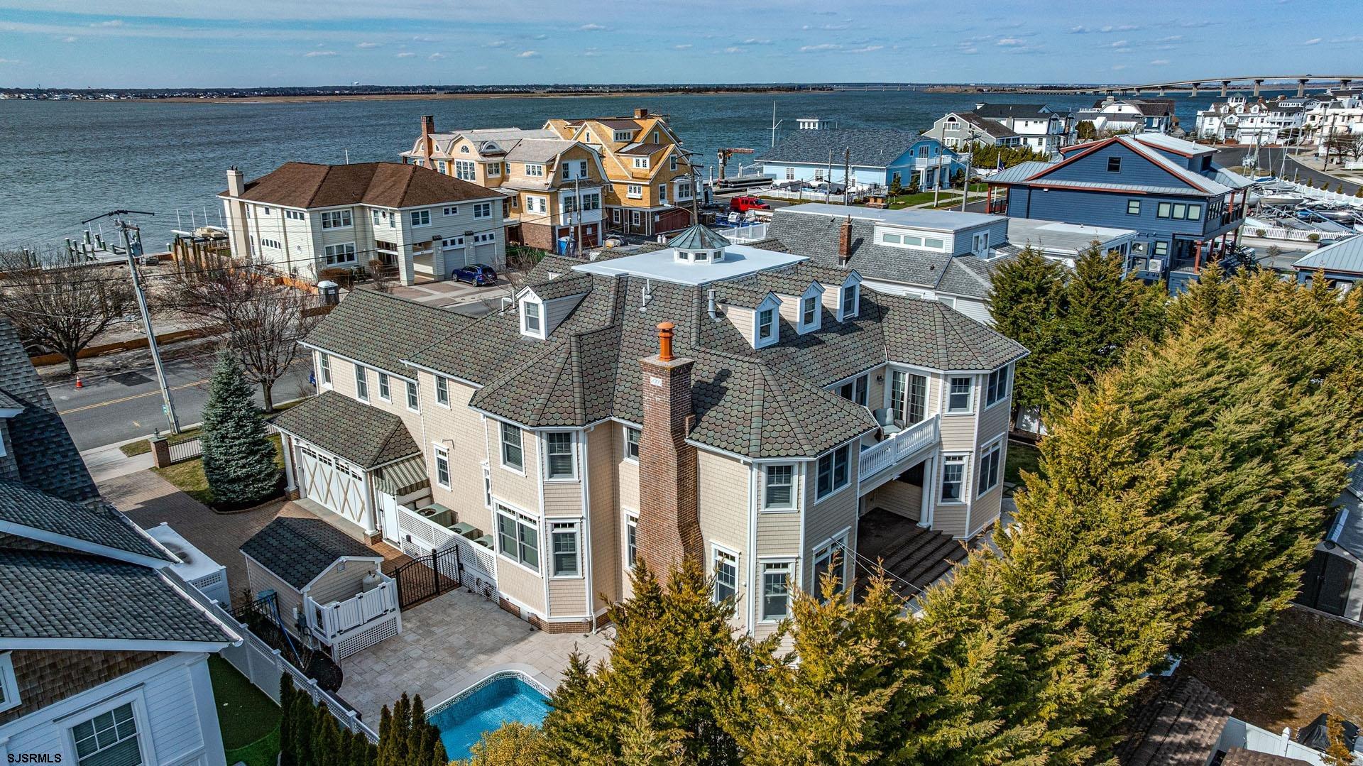 53 Bay Road Ocean City, NJ 08226 - Photo 58 of 68 an aerial view of multiple houses with a yard