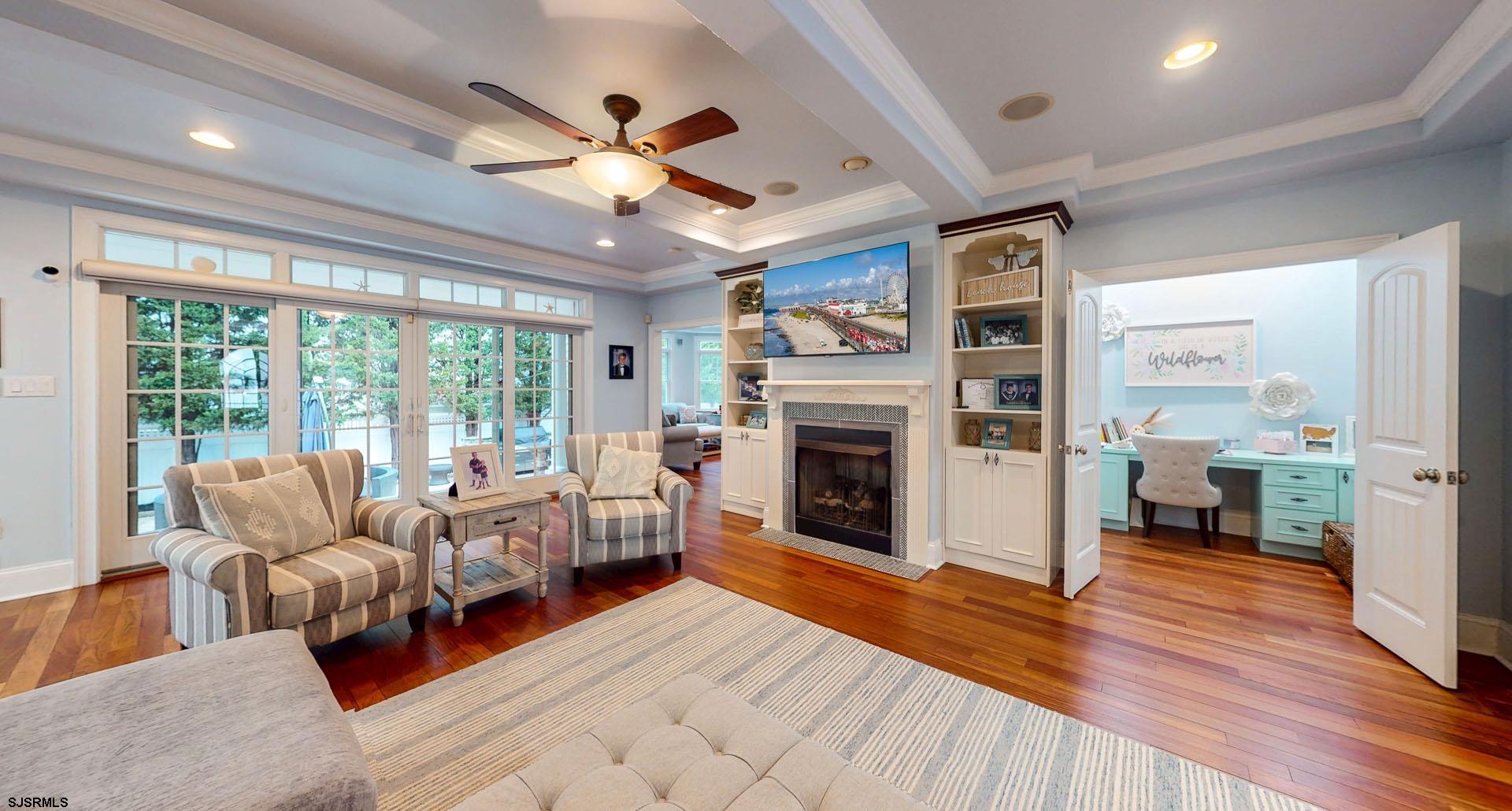 53 Bay Road Ocean City, NJ 08226 - Photo 7 of 68 a living room with furniture large window and a fireplace