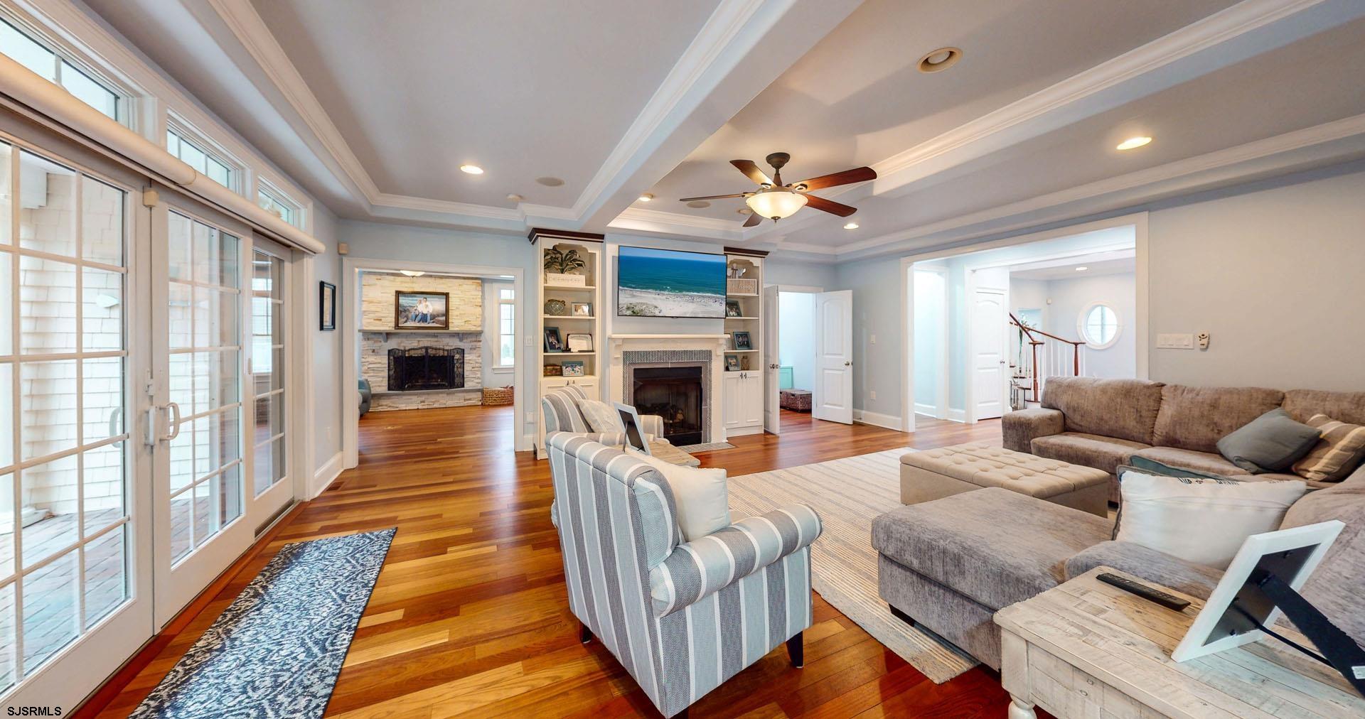 53 Bay Road Ocean City, NJ 08226 - Photo 8 of 68 a living room with furniture fireplace and a large window