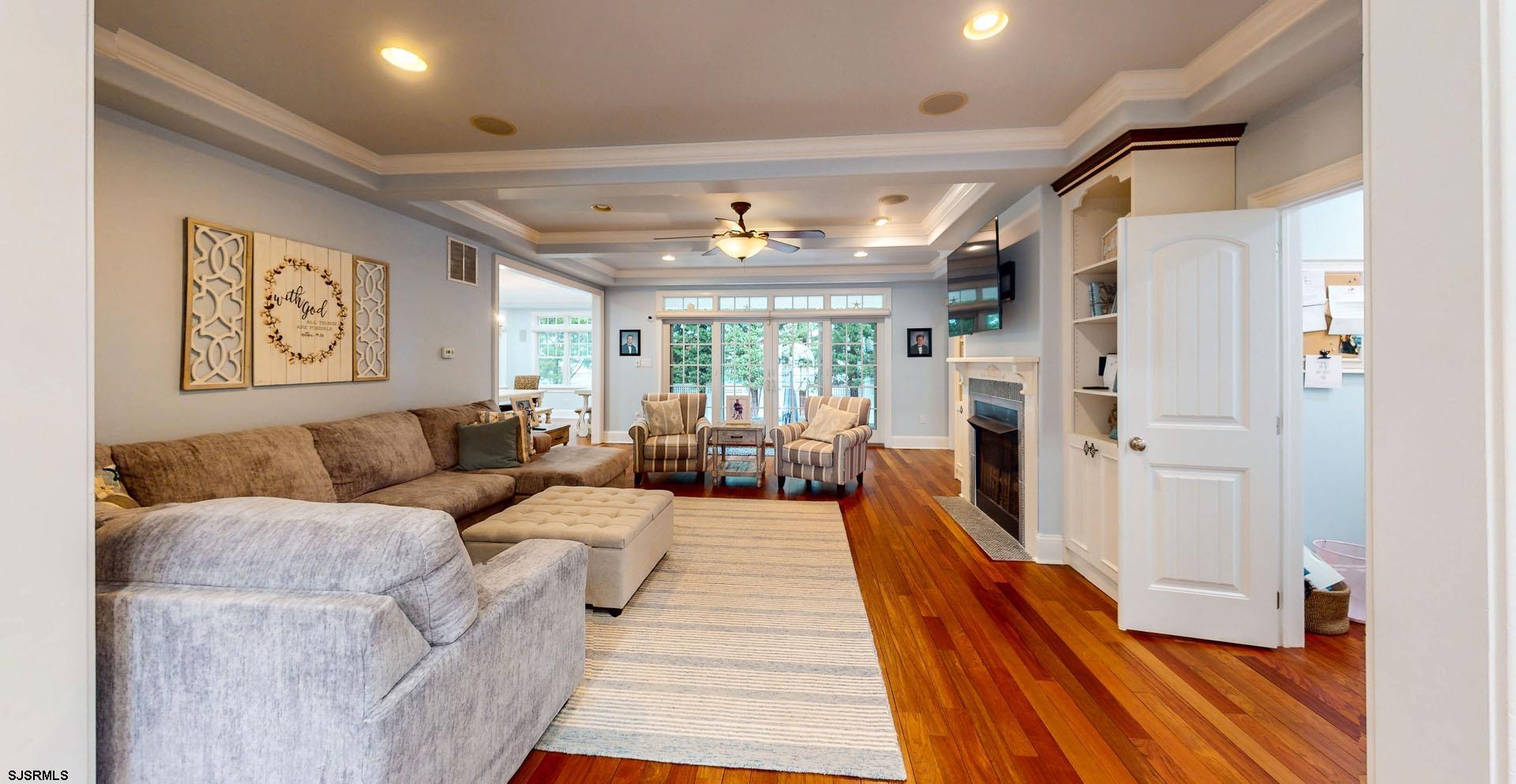 53 Bay Road Ocean City, NJ 08226 - Photo 9 of 68 a living room with furniture and a fireplace