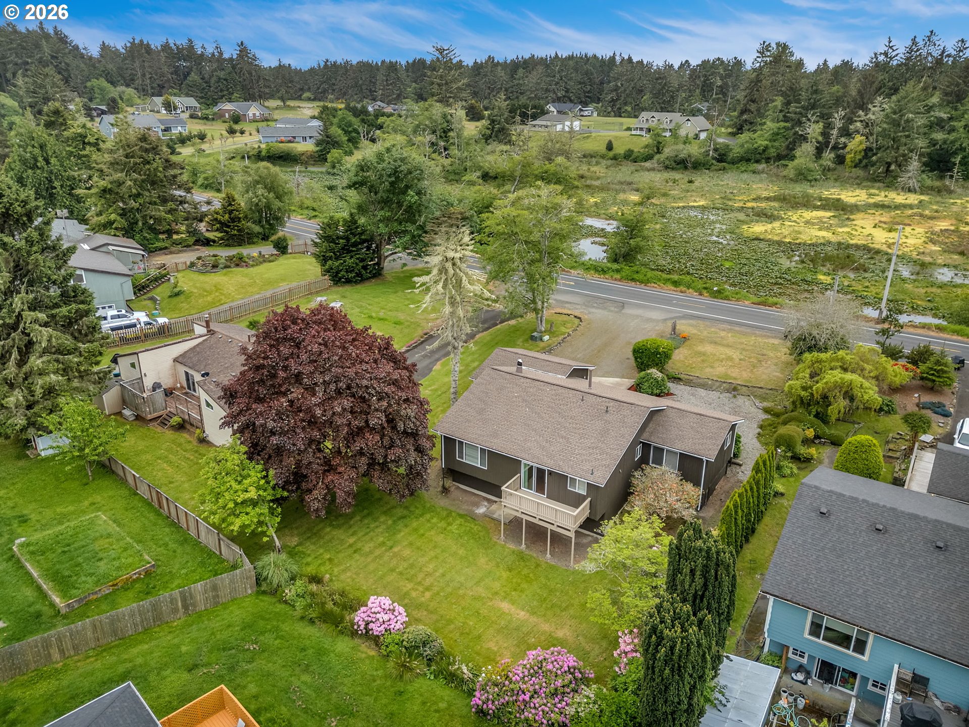 91923 Ridge Road Warrenton, OR 97146 - Photo 32 of 35 an aerial view of a house with a garden