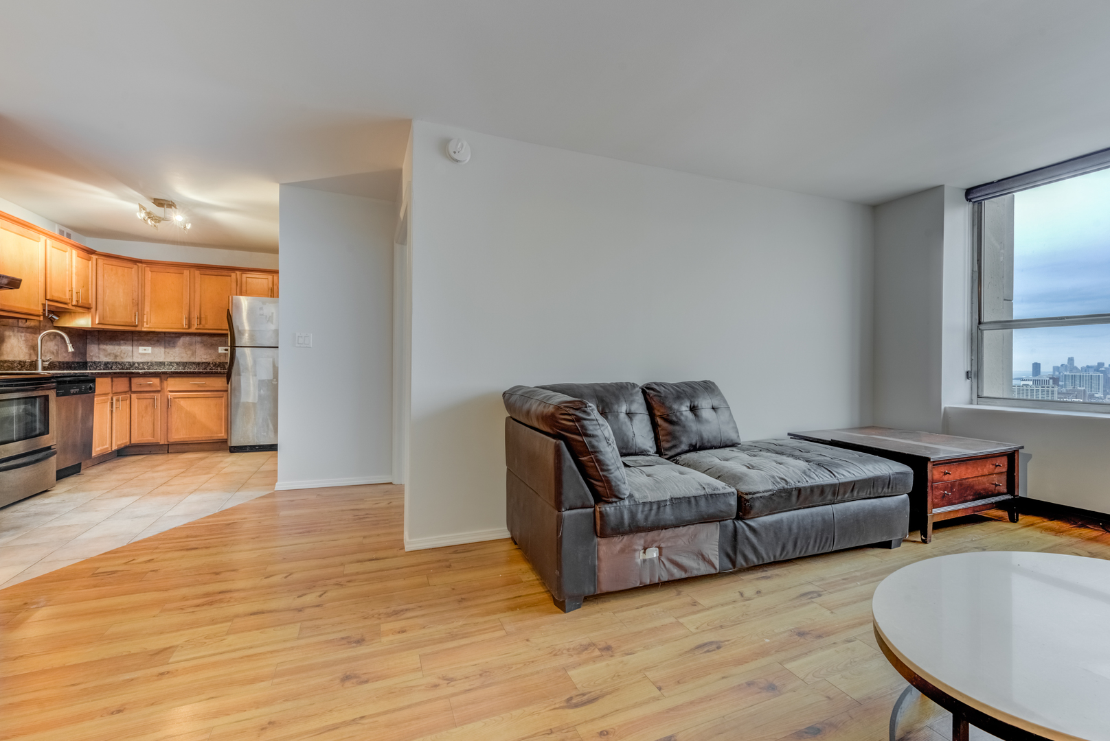 655 West Irving Park Road, Unit 5011 Chicago, IL 60613 - Photo 11 of 23 a living room with furniture and a wooden floor