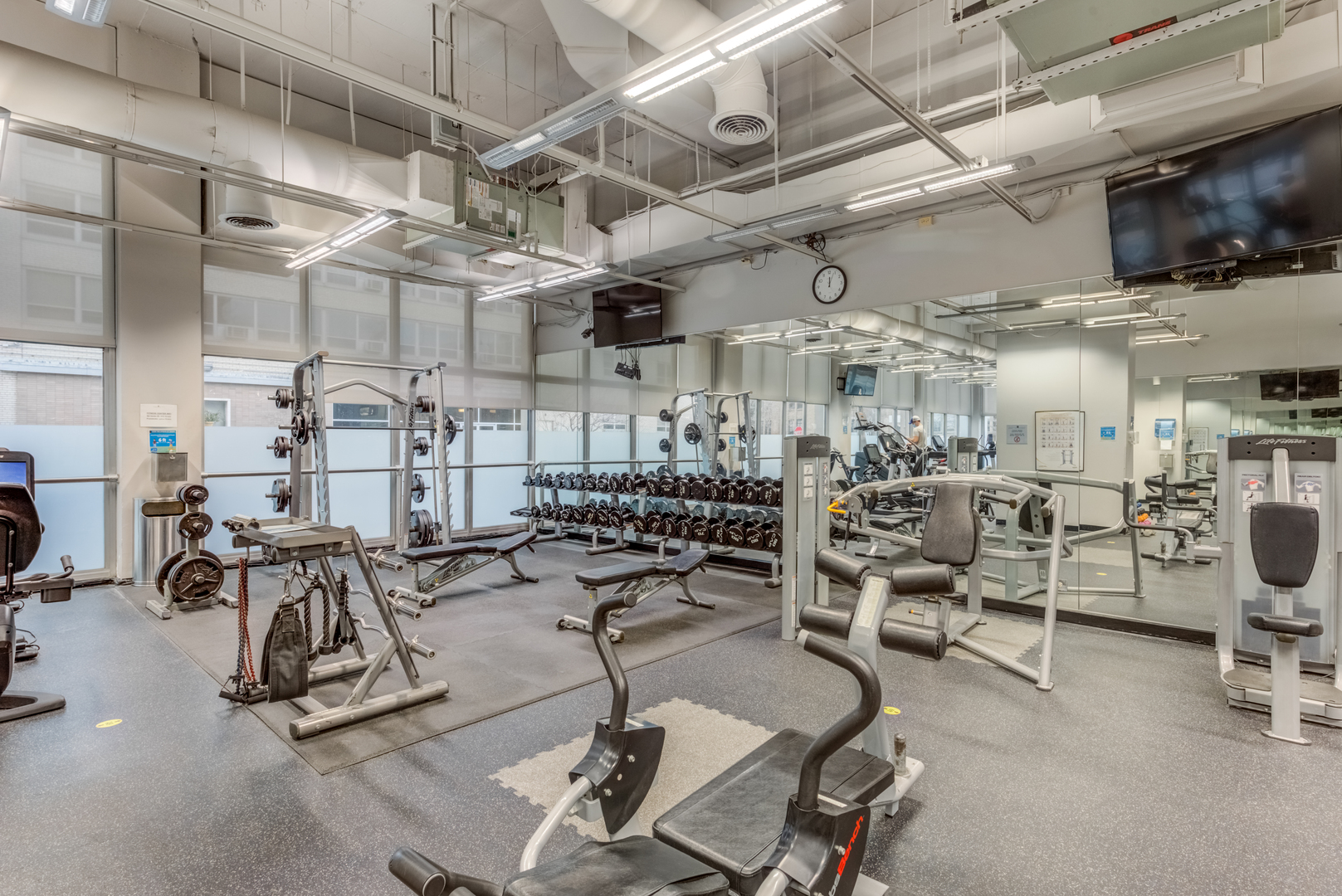 655 West Irving Park Road, Unit 5011 Chicago, IL 60613 - Photo 18 of 23 a view of a room with gym equipment