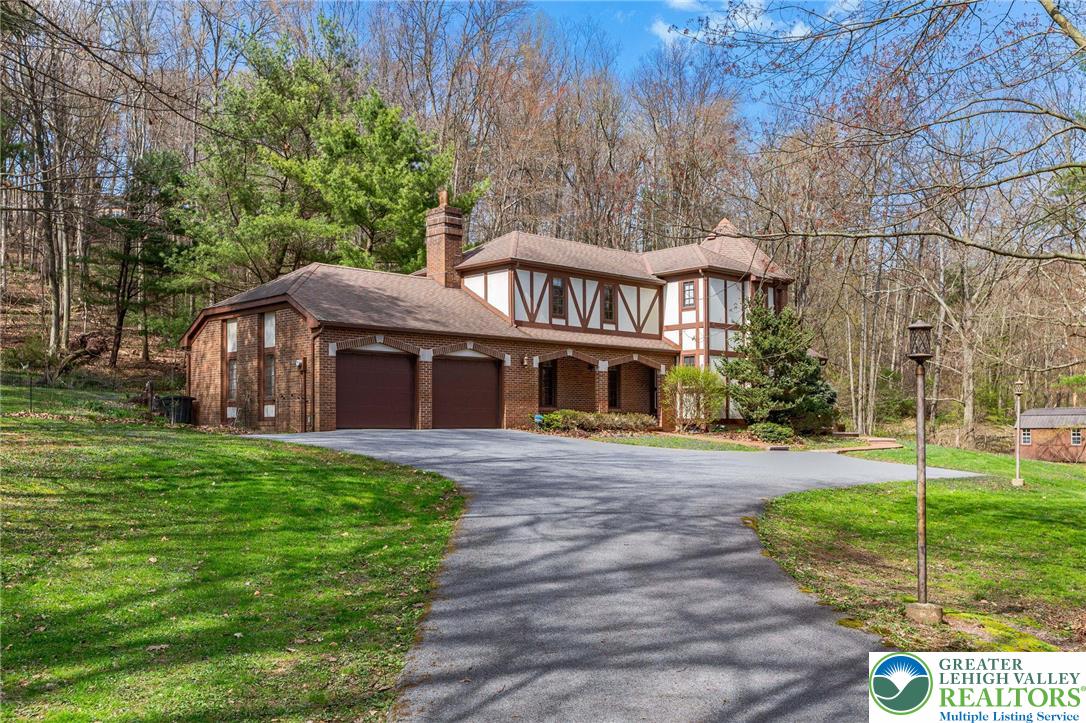 79 Country Club Road Ashland, PA 17921 - Photo 2 of 47 a front view of a house with a yard and green space