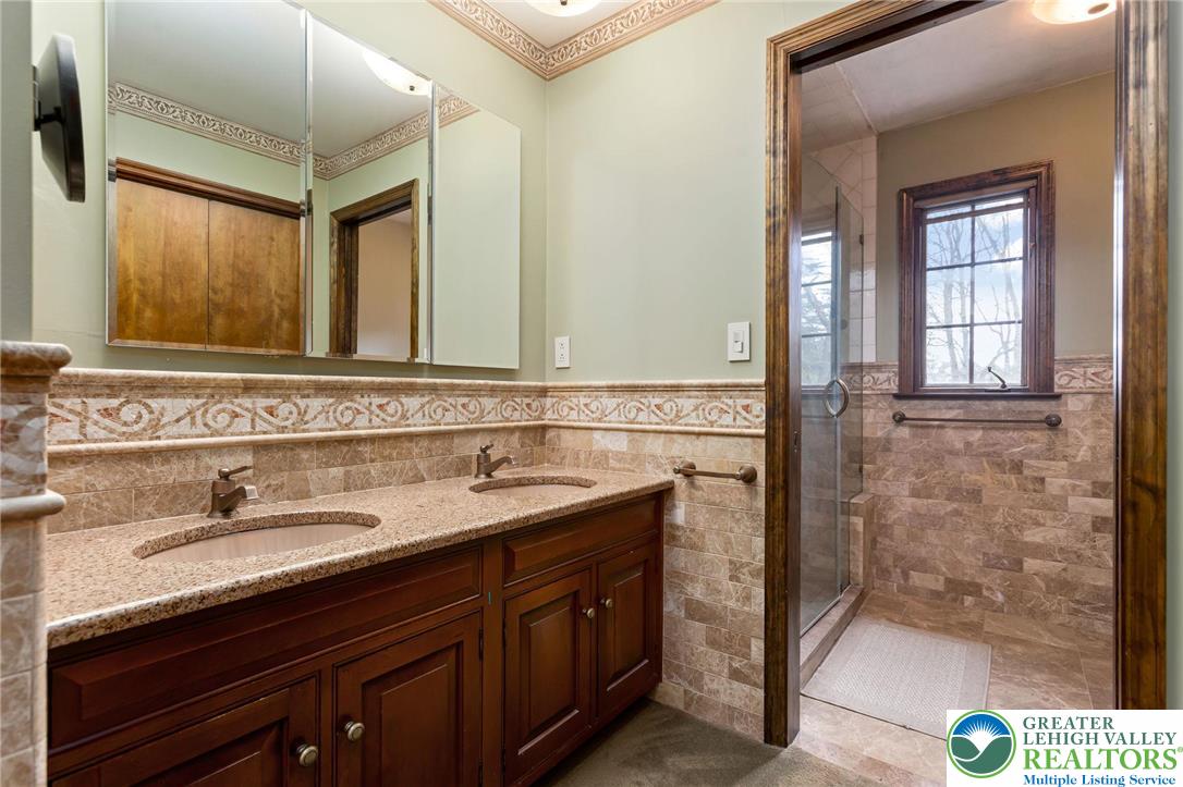 79 Country Club Road Ashland, PA 17921 - Photo 29 of 47 a bathroom with a sink and a mirror