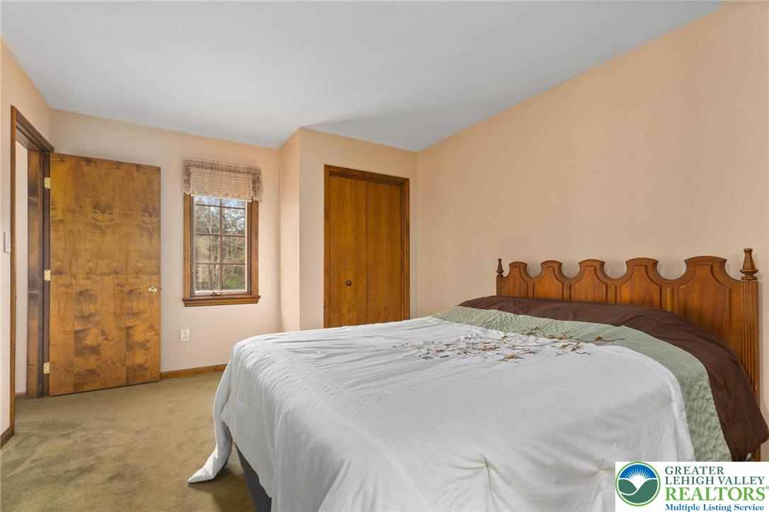 79 Country Club Road Ashland, PA 17921 - Photo 33 of 47 a bed sitting in a bedroom next to a window