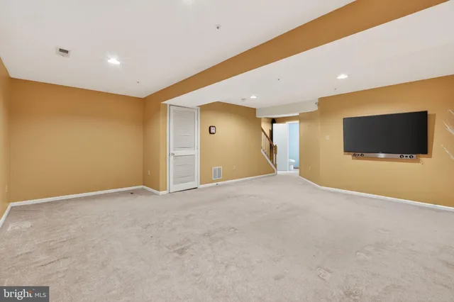 a view of an empty room with a flat screen tv