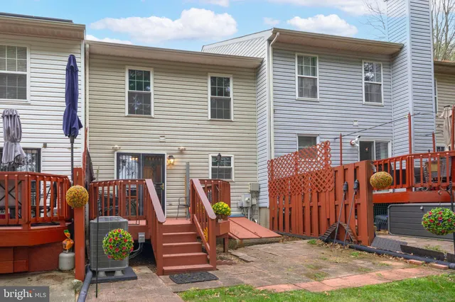 a view of a two chairs in the back yard