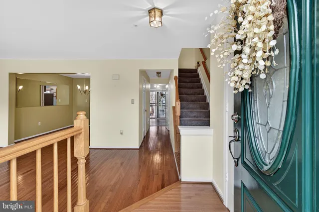 a view of an entryway with wooden floor