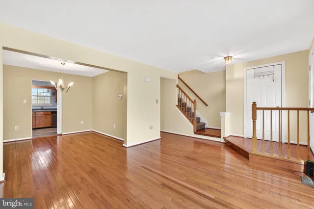 a view of an entryway with wooden floor