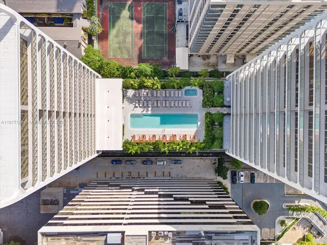 a view of a chair and table in the backyard