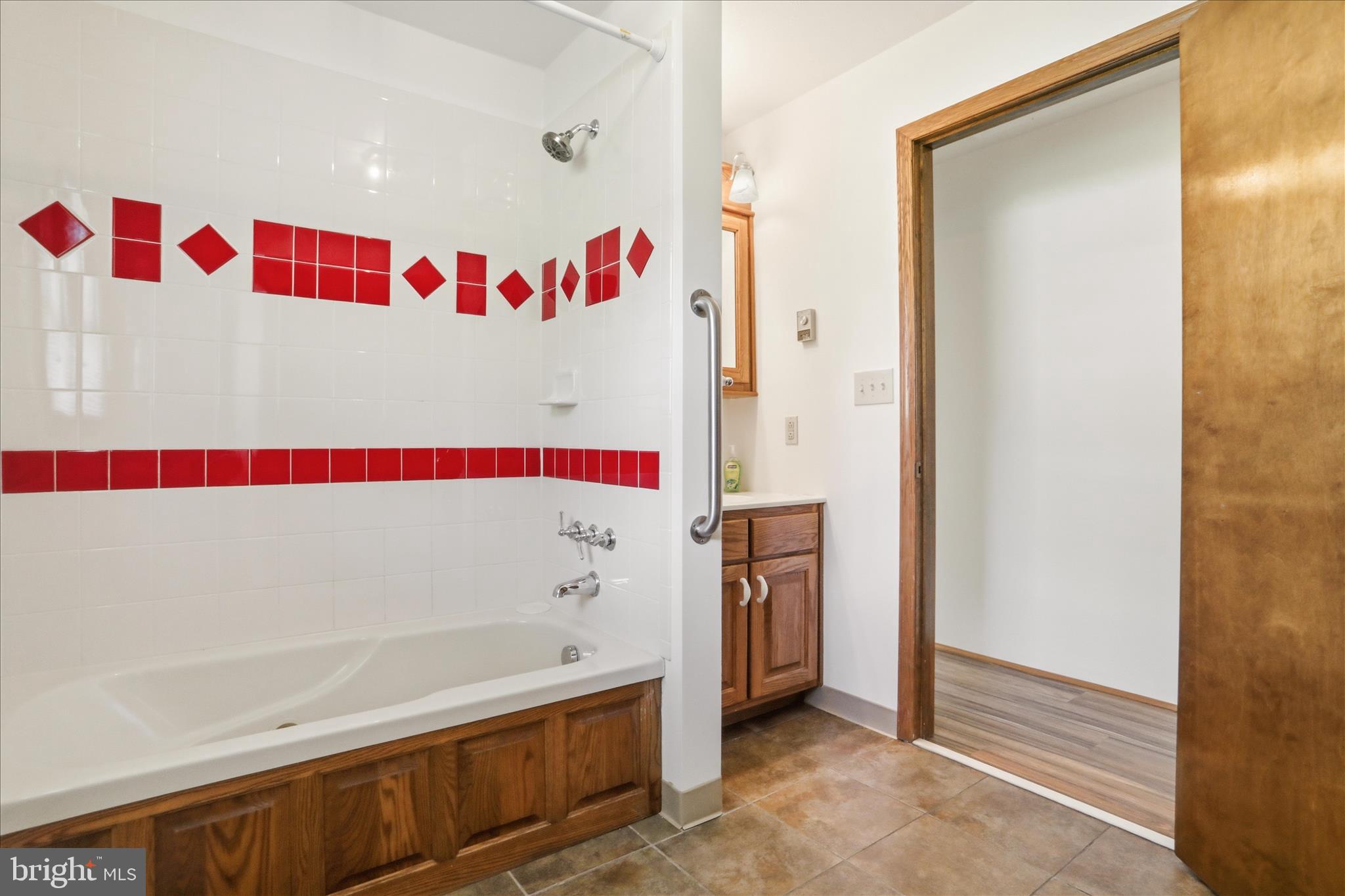 12623 Windy Ridge Drive Mount Savage, MD 21545 - Photo 17 of 72 a bathroom with a bathtub and a shower
