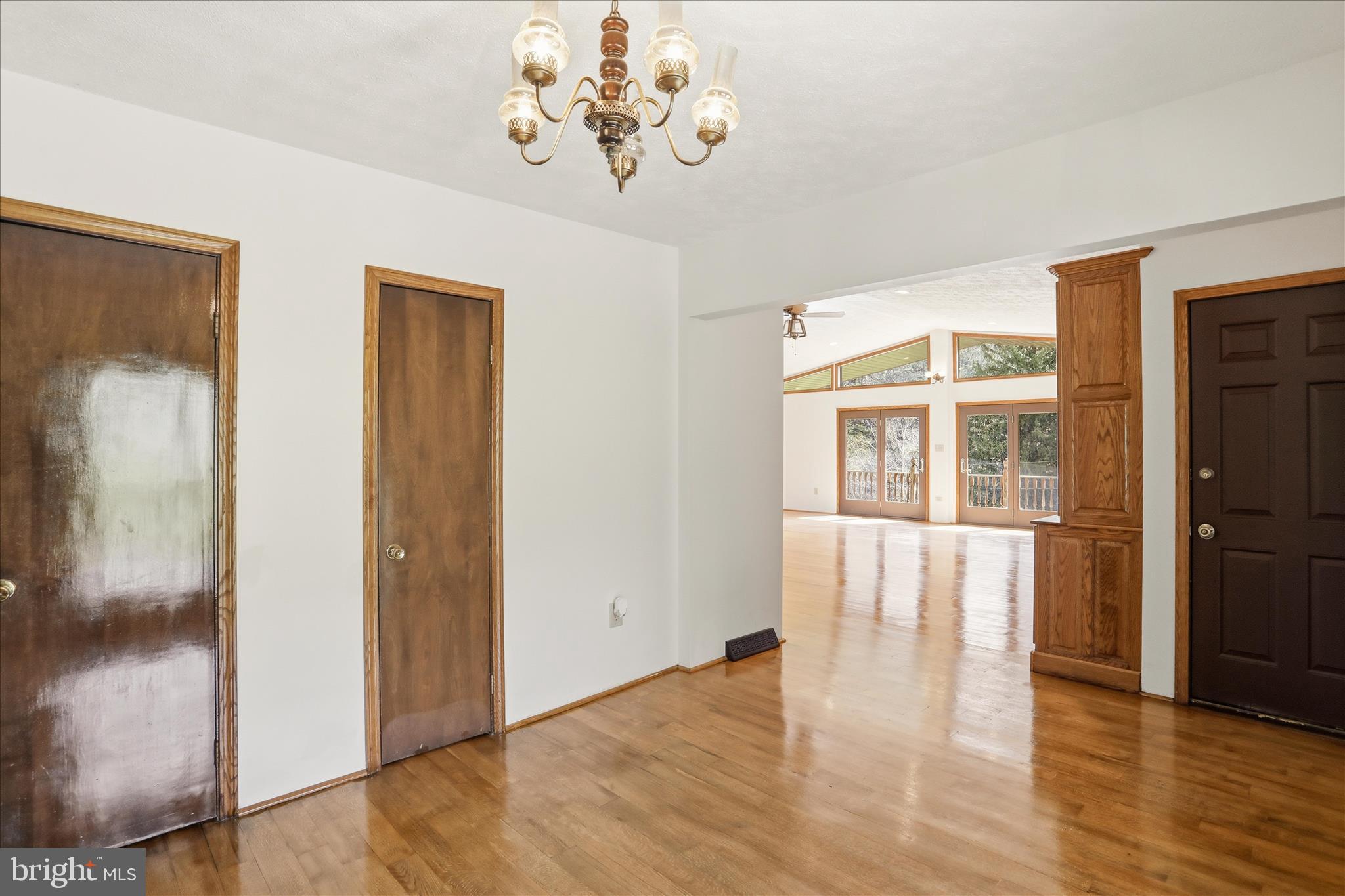 12623 Windy Ridge Drive Mount Savage, MD 21545 - Photo 30 of 72 a view of an empty room with wooden floor and a window