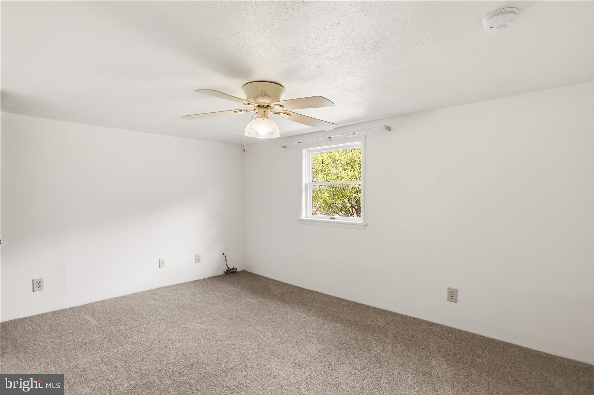 12623 Windy Ridge Drive Mount Savage, MD 21545 - Photo 41 of 72 an empty room with a window and a fan