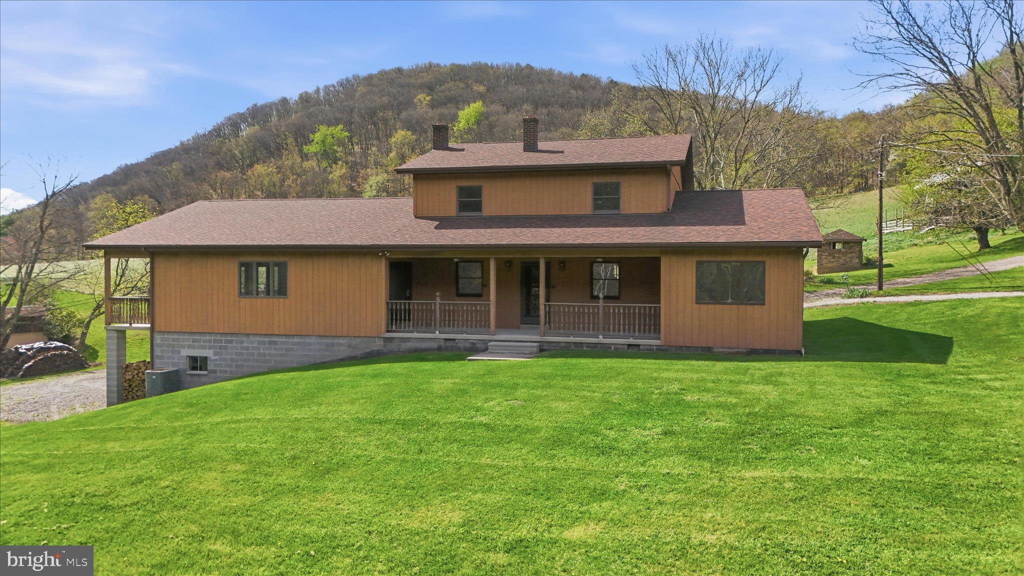 12623 Windy Ridge Drive Mount Savage, MD 21545 - Photo 10 of 72 a front view of a house with a garden