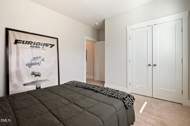 a bedroom with a bed and wall painting