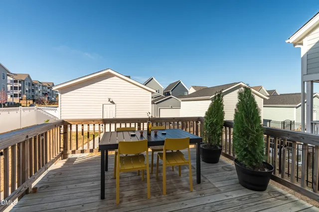 a view of a deck with two chair and table