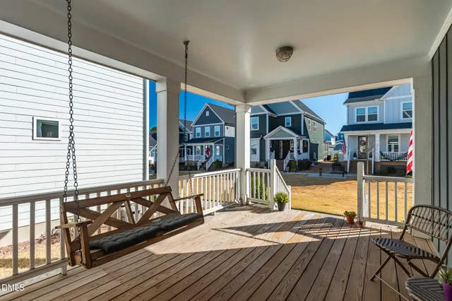 a view of a house with wooden deck