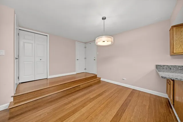 an empty room with wooden floor