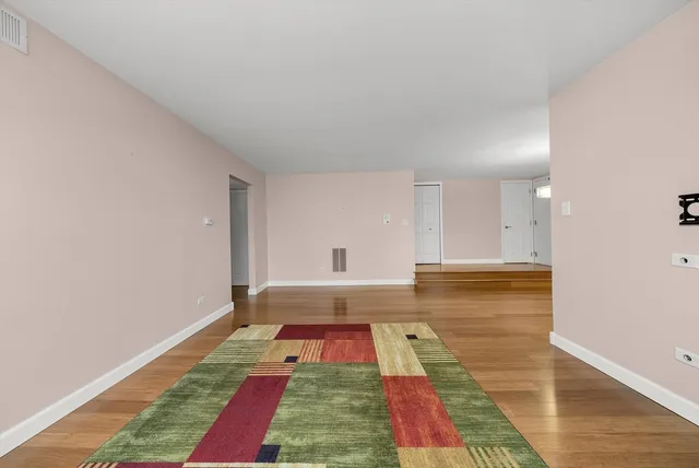a room with pool table and rug