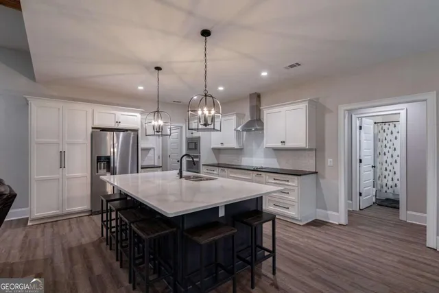 a kitchen with a table and chairs in it