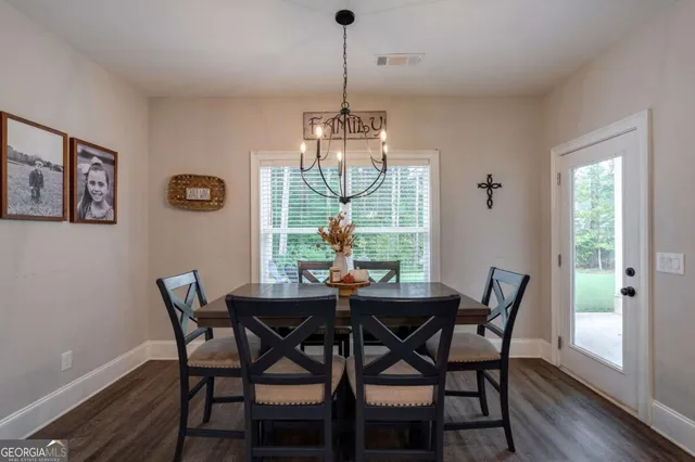 a room with a dresser and a mirror