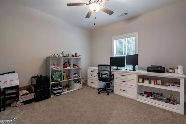 a spacious bathroom with a granite countertop sink a large mirror and a bathtub