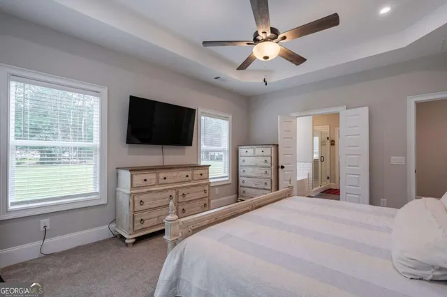 a bathroom with a bathtub and shower