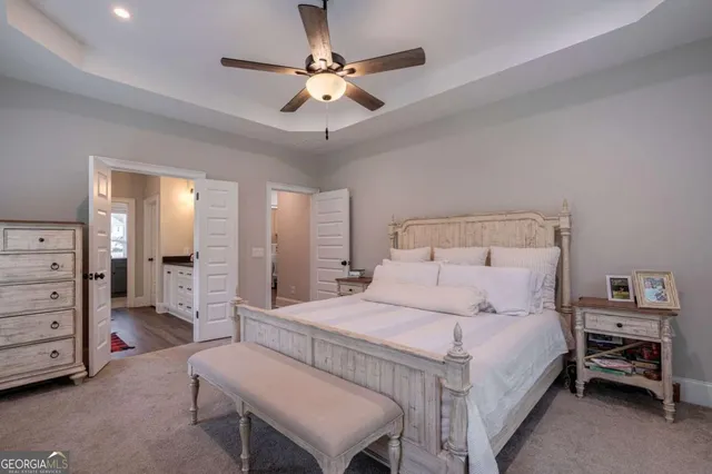 a white bath tub sitting in a bathroom next to a window
