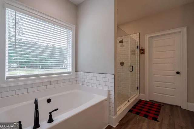 a bathroom with a sink toilet and mirror