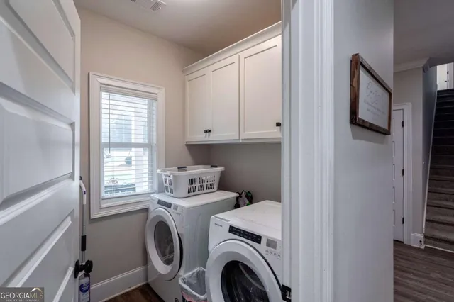 a living room with furniture and a lamp