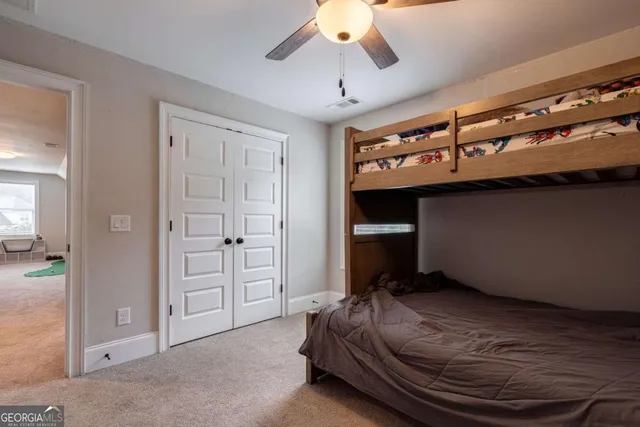 a living room with furniture rug and a lamp