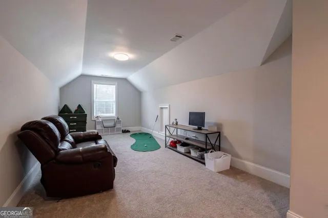 a view of a workspace with furniture