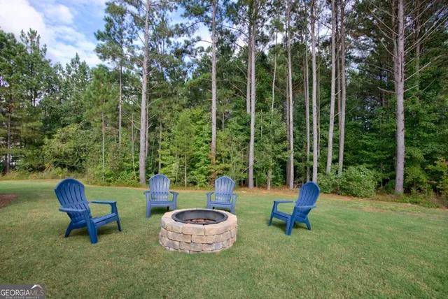 a outdoor view with a sitting space and garden