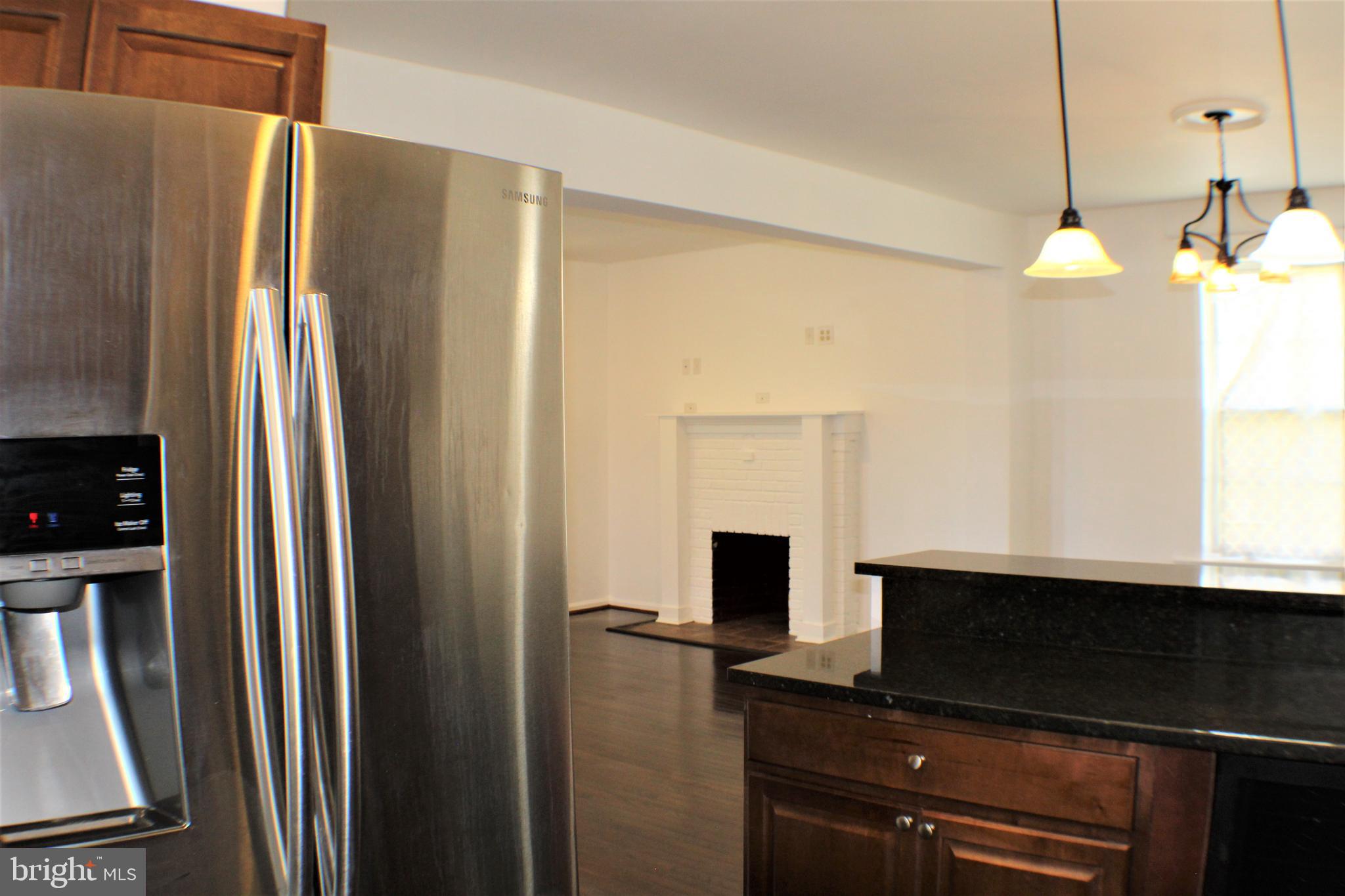 6418 Dogwood Road Baltimore, MD 21207 - Photo 12 of 33 View of Kitchen Granite Counter Top w/ Living Room
