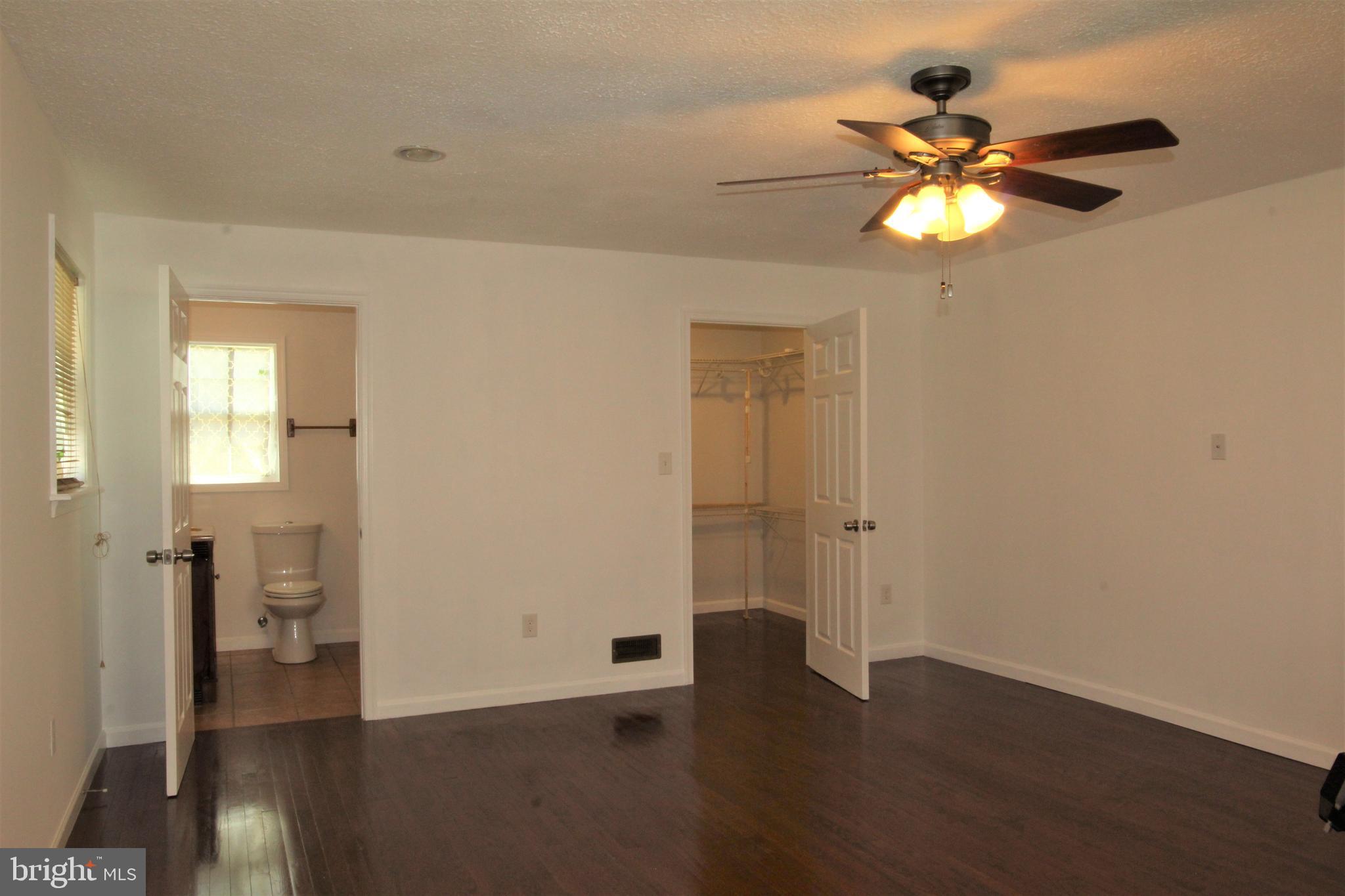6418 Dogwood Road Baltimore, MD 21207 - Photo 14 of 33 Master Bedroom w/ view of Bath and walk-in closet