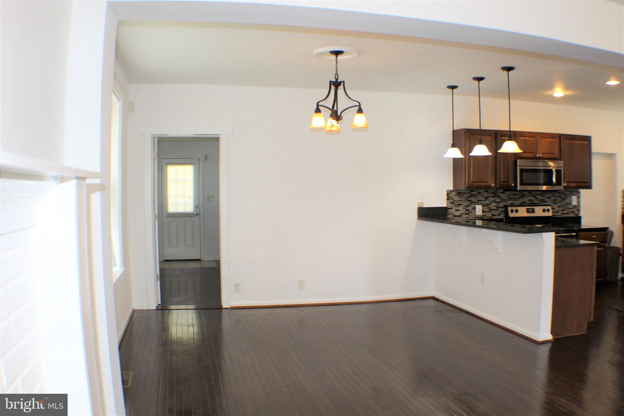 6418 Dogwood Road Baltimore, MD 21207 - Photo 8 of 33 Dining Room and Kitchen w/ view of Master Bedroom