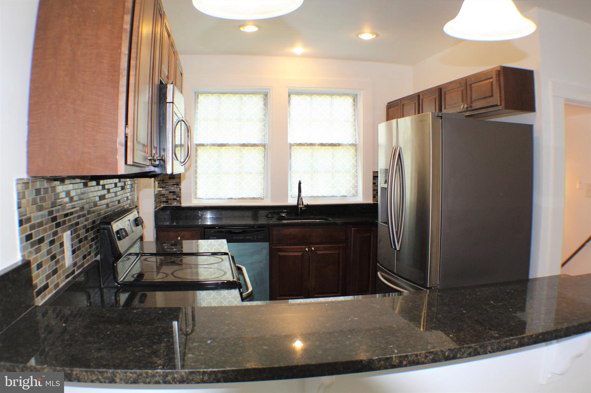 6418 Dogwood Road Baltimore, MD 21207 - Photo 10 of 33 Kitchen with Granite Counter Tops